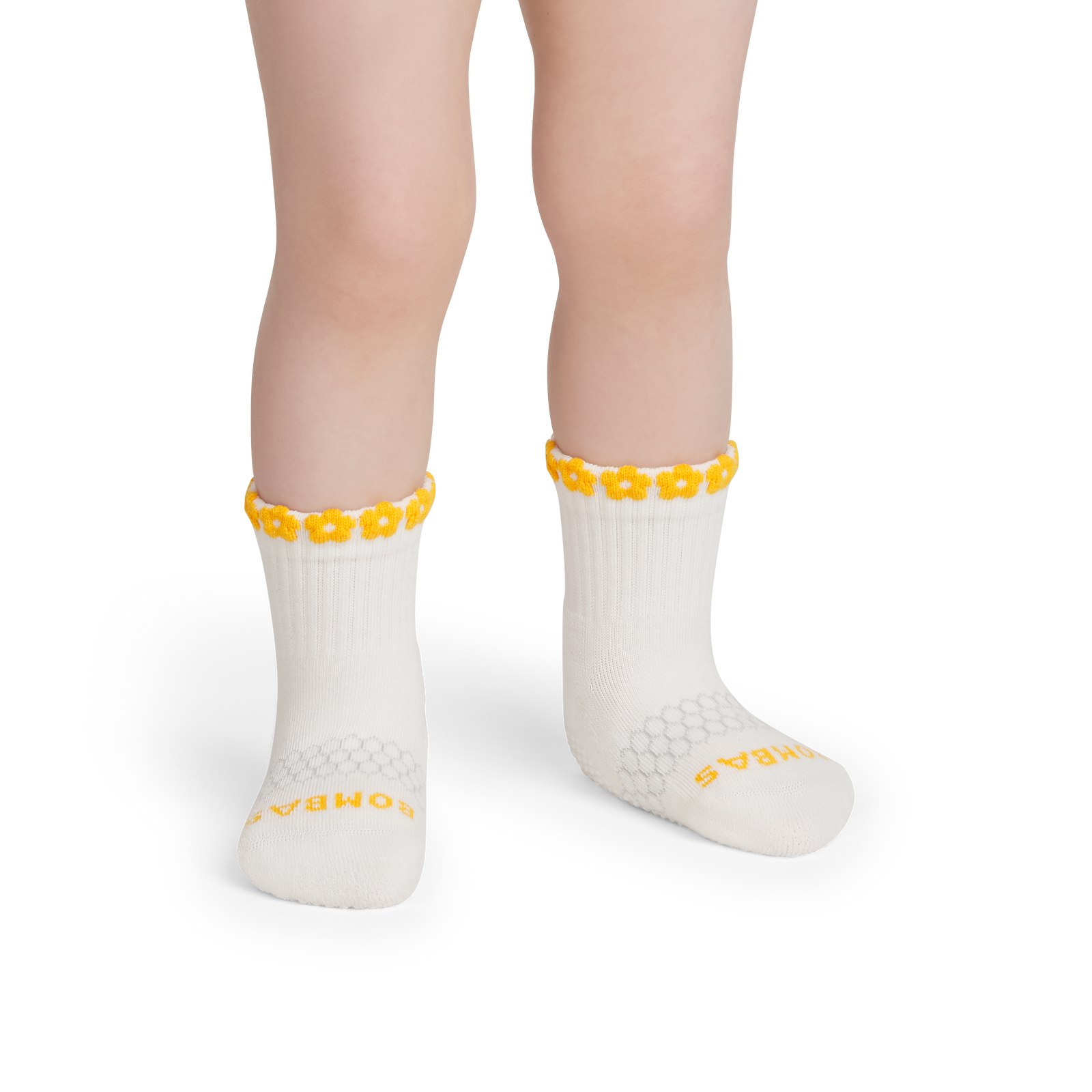 official-bombas::10144-softwhite-ambersun-toddler-unisex-onmodel-2-transparent.png