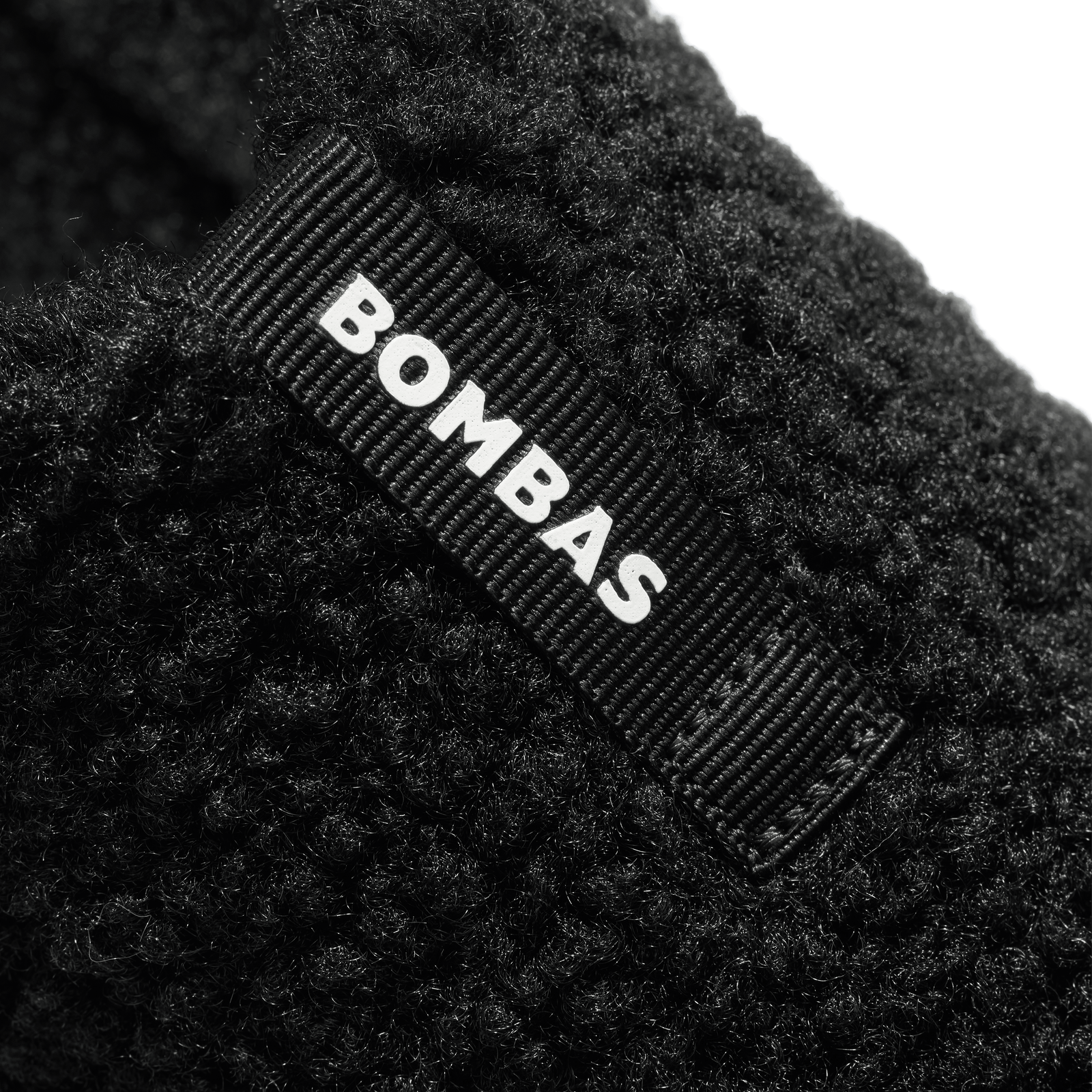 official-bombas::6074-black-adult-detail-5-transparent.png