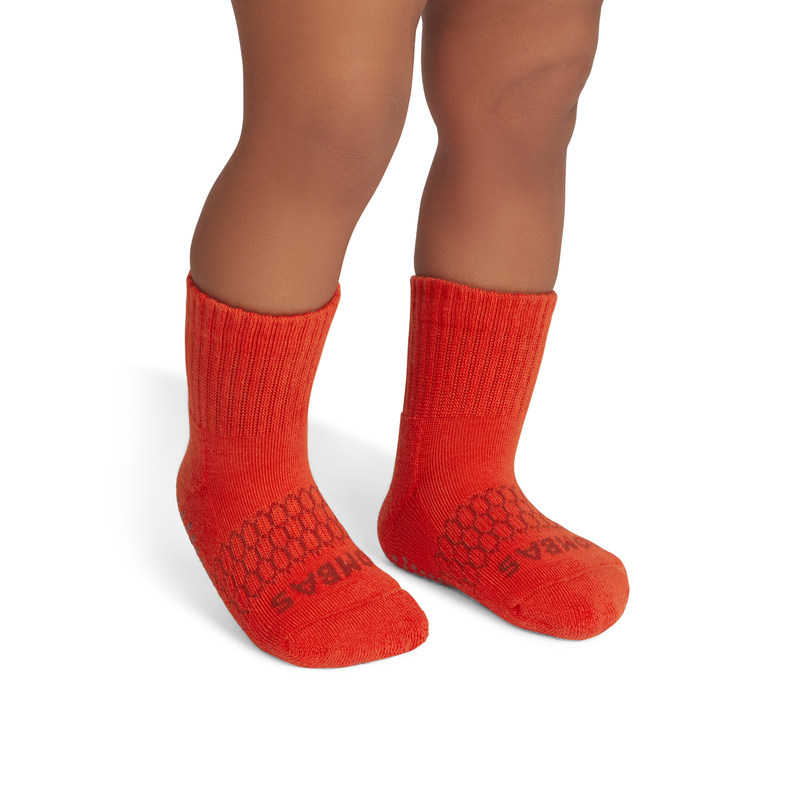 official-bombas::7579-burntorange-rust-toddler-unisex-onmodel-2-transparent.png